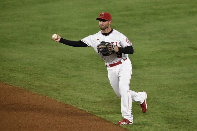 Los Angeles Angels second baseman Tommy La Stella throws to first base during the fifth inning of a baseball game against the Seattle Mariners in Anaheim, Calif., Tuesday, July 28, 2020. (AP Photo/Kelvin Kuo)