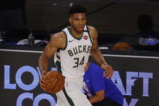 Milwaukee Bucks' Giannis Antetokounmpo (34) moves the ball up court against the Orlando Magic during Game 3 of an NBA basketball first-round playoff series, Saturday, Aug. 22, 2020, in Lake Buena Vista, Fla. (Mike Ehrmann/Pool Photo via AP)