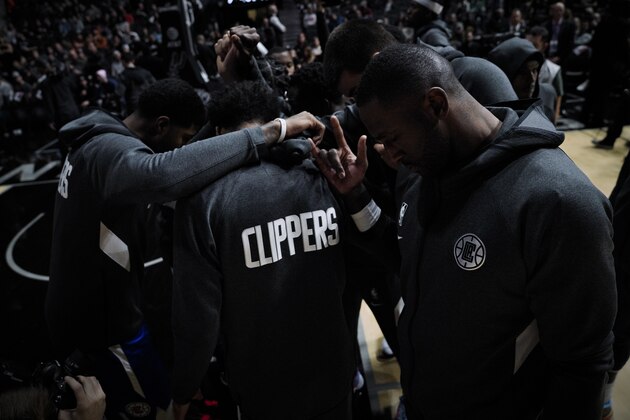 Los Angeles Clippers players huddle before the first half of an NBA basketball game against the San Antonio Spurs, Friday, Nov. 29, 2019, in San Antonio. San Antonio won 107-97. (AP Photo/Darren Abate) Los Angeles Clippers players huddle before the first half of an NBA basketball game against the San Antonio Spurs, Friday, Nov. 29, 2019, in San Antonio. San Antonio won 107-97. (AP Photo/Darren Abate)