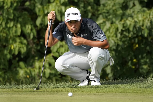 Hideki Matsuyama, of Japan, looks over the line before a birdie putt on the 16th green during the third round of the BMW Championship golf tournament Saturday, Aug. 29, 2020, at Olympia Fields Country Club in Olympia Fields, Ill. Matsuyama and Dustin Johnson are tied for the lead. (AP Photo/Charles Rex Arbogast)