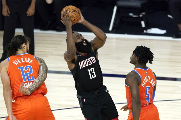 Houston Rockets' James Harden (13) shoots as Oklahoma City Thunder's Luguentz Dort (5) and Steven Adams (12) defend during the second half of an NBA basketball first round playoff game Saturday, Aug. 29, 2020, in Lake Buena Vista, Fla. (AP Photo/Ashley Landis) Houston Rockets' James Harden (13) shoots as Oklahoma City Thunder's Luguentz Dort (5) and Steven Adams (12) defend during the second half of an NBA basketball first round playoff game Saturday, Aug. 29, 2020, in Lake Buena Vista, Fla. (AP Photo/Ashley Landis)
