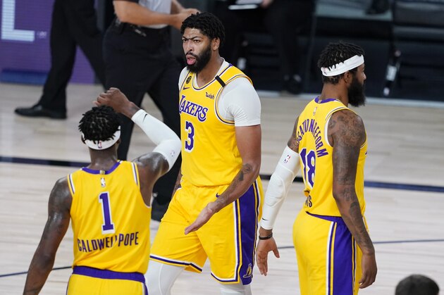 Los Angeles Lakers' Anthony Davis (3) and Kentavious Caldwell-Pope (1) celebrate after a play against the Portland Trail Blazers during the second half of an NBA basketball first round playoff game Saturday, Aug. 29, 2020, in Lake Buena Vista, Fla. (AP Photo/Ashley Landis) Los Angeles Lakers' Anthony Davis (3) and Kentavious Caldwell-Pope (1) celebrate after a play against the Portland Trail Blazers during the second half of an NBA basketball first round playoff game Saturday, Aug. 29, 2020, in Lake Buena Vista, Fla. (AP Photo/Ashley Landis)