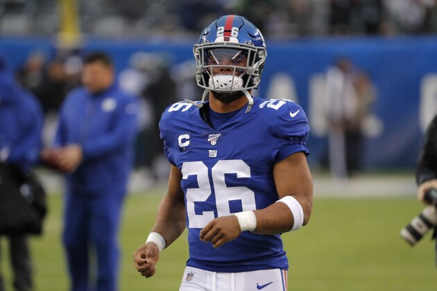 New York Giants running back Saquon Barkley (26) warms up before an NFL football game against the Philadelphia Eagles, Sunday, Dec. 29, 2019, in East Rutherford, N.J. (AP Photo/Seth Wenig)