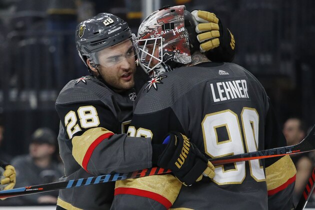Vegas Golden Knights left wing William Carrier (28) celebrates with goaltender Robin Lehner after defeating the New Jersey Devils in an NHL hockey game Tuesday, March 3, 2020, in Las Vegas. (AP Photo/John Locher)