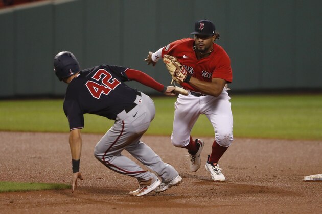Boston Red Sox shortstop Xander Bogaerts chases down Washington Nationals' Trea Turner who was caught in a rundown during the fourth inning of a baseball game Friday, Aug. 28, 2020, at Fenway Park in Boston. (AP Photo/Winslow Townson) Boston Red Sox shortstop Xander Bogaerts chases down Washington Nationals' Trea Turner who was caught in a rundown during the fourth inning of a baseball game Friday, Aug. 28, 2020, at Fenway Park in Boston. (AP Photo/Winslow Townson)