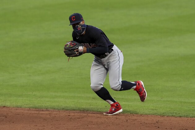 Cleveland Indians' Francisco Lindor (12) fields the ball during a baseball game against the Cincinnati Reds in Cincinnati, Tuesday, Aug. 4, 2020. The Indians won 4-2. (AP Photo/Aaron Doster) Cleveland Indians' Francisco Lindor (12) fields the ball during a baseball game against the Cincinnati Reds in Cincinnati, Tuesday, Aug. 4, 2020. The Indians won 4-2. (AP Photo/Aaron Doster)