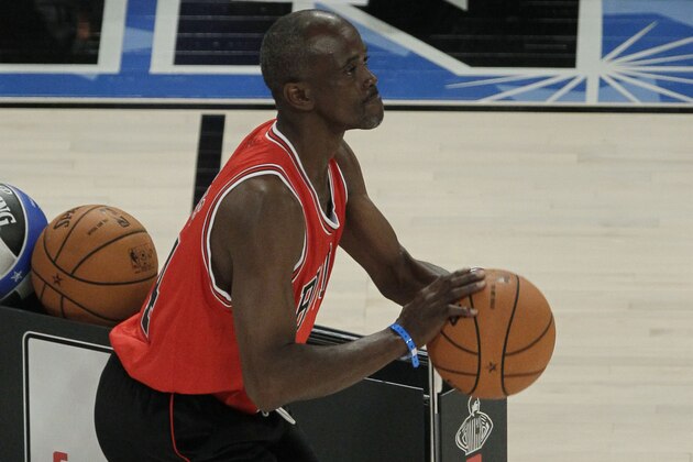 Former NBA All Star Craig Hodges aims during the NBA All Star basketball three point contest in Orlando, Fla. Friday, Feb. 25, 2012. (AP Photo/Chris O'Meara)