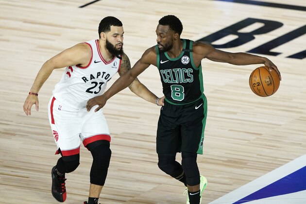 Boston Celtics' Kemba Walker (8) moves the ball against Toronto Raptors' Fred VanVleet (23) during the first half of an NBA basketball conference semifinal playoff game Sunday, Aug. 30, 2020, in Lake Buena Vista, Fla. (AP Photo/Ashley Landis)