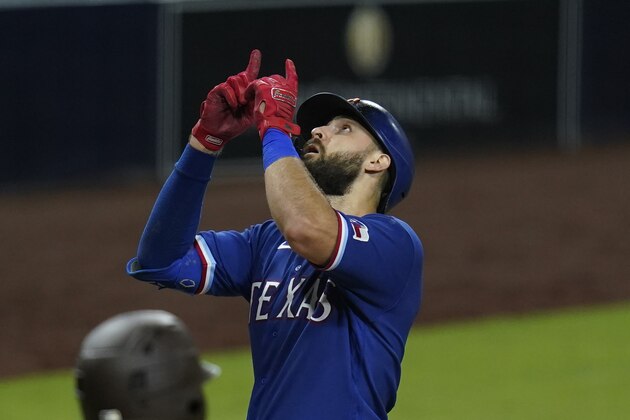 Texas Rangers' Joey Gallo gestures after hitting a home run during the ninth inning of the team's baseball game against the San Diego Padres, Wednesday, Aug. 19, 2020, in San Diego. (AP Photo/Gregory Bull)