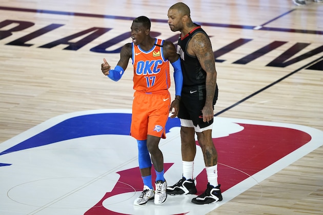 Houston Rockets' P.J. Tucker, right, confronts Oklahoma City Thunder's Dennis Schroder (17) after a foul during the second half of an NBA basketball first round playoff game Saturday, Aug. 29, 2020, in Lake Buena Vista, Fla. Both players were ejected. (AP Photo/Ashley Landis)