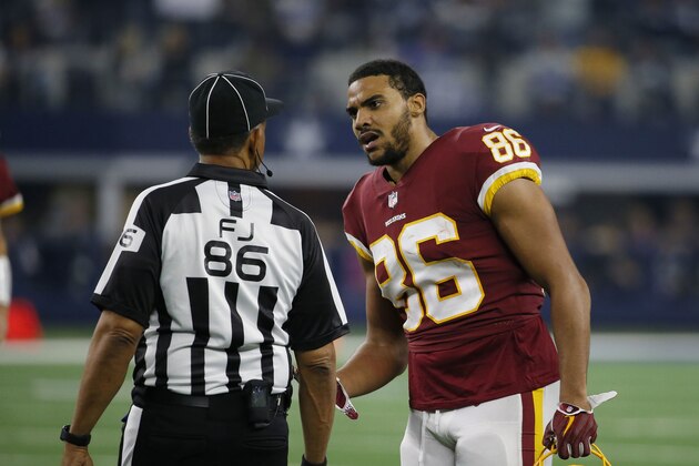 Washington Redskins tight end Jordan Reed (86) talks to field judge Jimmy Buchanan about a call during the second half of an NFL football game between the Dallas Cowboys and Washington Redskins in Arlington, Texas, Thursday, Nov. 22, 2018. The Dallas Cowboys won 31-23. (AP Photo/Roger Steinman)