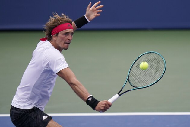 Alexander Zverev, of Germany, returns a shot to Andy Murray, of Great Britain, during the second round at the Western & Southern Open tennis tournament Monday, Aug. 24, 2020, in New York. (AP Photo/Frank Franklin II)