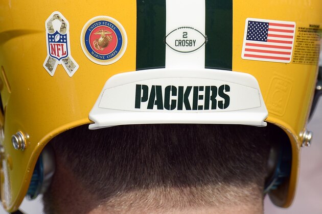 Green Bay Packers kicker Mason Crosby wears a Salute to Service decal along with Marine Corps and American flag decals on his helmet before an NFL football game between the Packers and the Tennessee Titans Sunday, Nov. 13, 2016, in Nashville, Tenn. (AP Photo/Mark Zaleski)