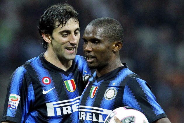 Inter Milan Argentine forward Diego Milito, left, talks with his teammate forward Samuel Eto'o, of Cameroon, prior to a penalty kick during a Serie A soccer match between Inter Milan and Bari at the San Siro stadium in Milan, Italy, Wednesday, Sept. 22, 2010. (AP Photo/Luca Bruno)