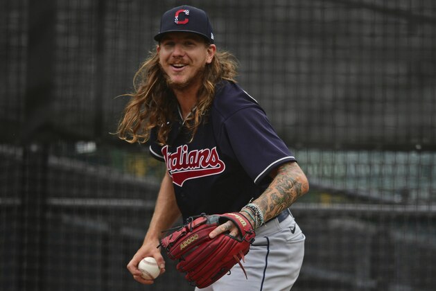 Cleveland Indians starting pitcher Mike Clevinger warms up in the bullpen before a simulated baseball game at Progressive Field, Friday, July 10, 2020, in Cleveland. (AP Photo/David Dermer)