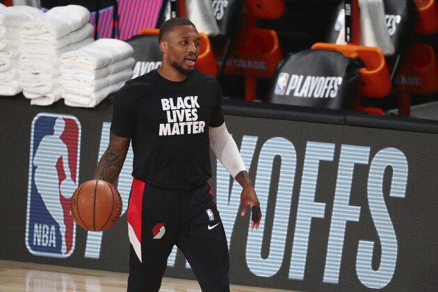 Portland Trail Blazers guard Damian Lillard warms up before Game 4 of an NBA basketball first-round playoff series against the Los Angeles Lakers, Monday, Aug. 24, 2020, in Lake Buena Vista, Fla. (Kim Klement/Pool Photo via AP)