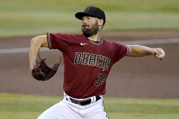 Arizona Diamondbacks starting pitcher Robbie Ray throws against the Colorado Rockies during the first inning of a baseball game, Wednesday, Aug. 26, 2020, in Phoenix. (AP Photo/Matt York)