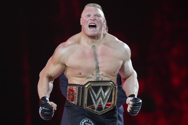 FILE - In this March 29, 2015, file photo, Brock Lesnar makes his entrance at Wrestlemania XXXI in Santa Clara, Calif. Lesnar, the former WWE and UFC heavyweight champion, was selected Monday, June 27, 2016, as the cover superstar for the WWE 2K17 video game that is set for an Oct. 11 release.  (AP Photo/Don Feria, File)