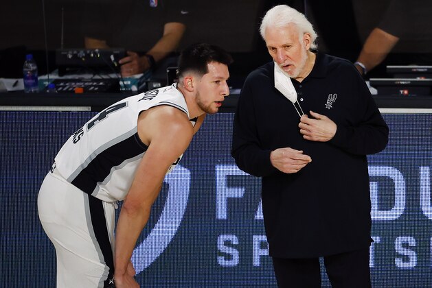 San Antonio Spurs head coach Gregg Popovich, right, talks with Drew Eubanks during the second quarter of an NBA basketball game against the Utah Jazz, Thursday, Aug. 13, 2020, in Lake Buena Vista, Fla. (Kevin C. Cox/Pool Photo via AP)