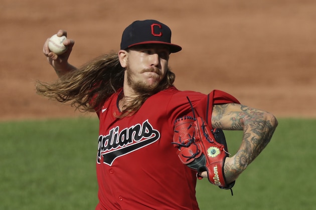 Cleveland Indians starting pitcher Mike Clevinger delivers in the third inning in a baseball game against the Kansas City Royals, Saturday, July 25, 2020, in Cleveland. (AP Photo/Tony Dejak) Cleveland Indians starting pitcher Mike Clevinger delivers in the third inning in a baseball game against the Kansas City Royals, Saturday, July 25, 2020, in Cleveland. (AP Photo/Tony Dejak)
