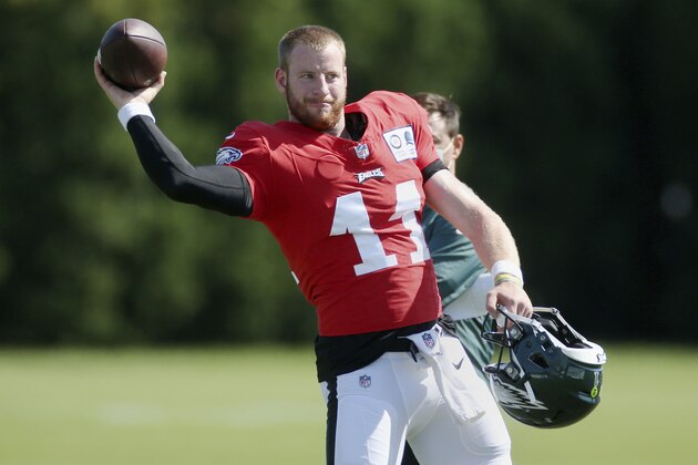 Philadelphia Eagles quarterback Carson Wentz (11) tosses the ball during NFL football training camp at the team's practice facility, Wednesday, Aug. 26, 2020, in Philadelphia. (Tim Tai/The Philadelphia Inquirer via AP, Pool)