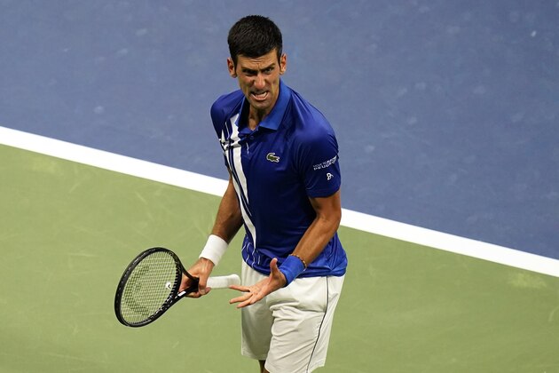 Novak Djokovic, of Serbia, reacts after a winning a set against Damir Dzumhur, of Bosnia and Herzegovina, during the first round of the US Open tennis championships, Monday, Aug. 31, 2020, in New York. (AP Photo/Frank Franklin II)