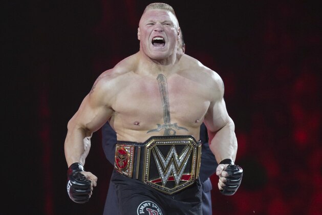 FILE - In this March 29, 2015, file photo, Brock Lesnar makes his entrance at Wrestlemania XXXI in Santa Clara, Calif. While real sports have shut down in the wake of the coronavirus pandemic, WWE has pressed on and is set to run this weekend its first WrestleMania in an empty arena. WWE stood firm that the show must go on and largely moved a card highlighted by stars Brock Lesnar and John Cena to its performance center in Orlando, Florida. (AP Photo/Don Feria, File)
