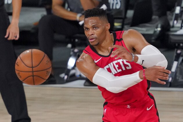 Houston Rockets' Russell Westbrook (0) makes a pass during the second half of an NBA first-round playoff basketball game against the Oklahoma City Thunder on Monday, Aug. 31, 2020, in Lake Buena Vista, Fla. (AP Photo/Mark J. Terrill)