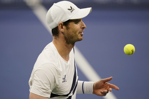 Andy Murray, of Great Britain, tosses the ball during his match with Milos Raonic, of Canada, during the third round at the Western & Southern Open tennis tournament Tuesday, Aug. 25, 2020, in New York. (AP Photo/Frank Franklin II)