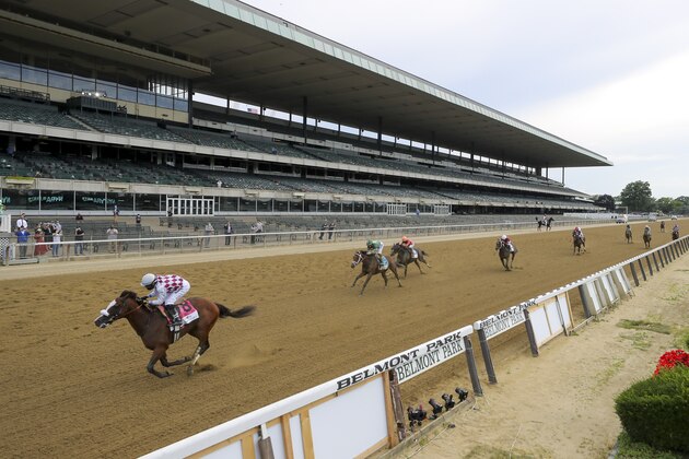 Tiz the Law (8), with jockey Manny Franco up, crosses the finish line in front of an empty grandstand to win the152nd running of the Belmont Stakes horse race, Saturday, June 20, 2020, in Elmont, N.Y. (AP Photo/Seth Wenig)