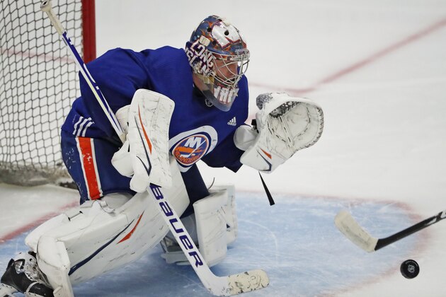 New York Islanders goaltender Semyon Varlamov sets up against a shot on goal during an NHL team hockey practice, Monday, July 13, 2020, at the team's practice facility in East Meadow, N.Y. (AP Photo/Kathy Willens) New York Islanders goaltender Semyon Varlamov sets up against a shot on goal during an NHL team hockey practice, Monday, July 13, 2020, at the team's practice facility in East Meadow, N.Y. (AP Photo/Kathy Willens)