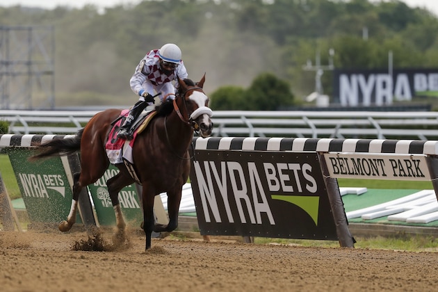 Tiz the Law (8), with jockey Manny Franco up, crosses the finish line to win the152nd running of the Belmont Stakes horse race, Saturday, June 20, 2020, in Elmont, N.Y. (AP Photo/Seth Wenig)