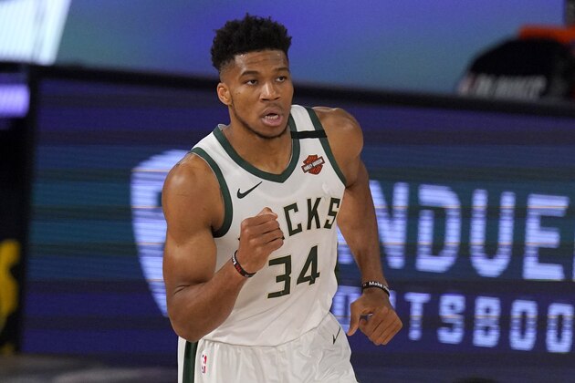Milwaukee Bucks' Giannis Antetokounmpo (34) celebrates a basket against the Miami Heat during the first half of an NBA basketball conference semifinal playoff game, Monday, Aug. 31, 2020, in Lake Buena Vista, Fla. (AP Photo/Mark J. Terrill)