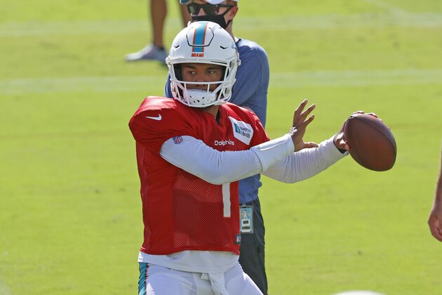 Miami Dolphins quarterback Tua Tagovailoa (1) throws the ball during an NFL football training camp practice in Davie, Fla., Tuesday, Aug. 18, 2020. (AP Photo/Joel Auerbach)
