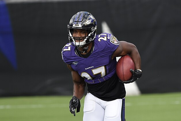 Baltimore Ravens J.K.Dobbins runs a drill during an NFL football training camp practice, Saturday, Aug. 29, 2020, in Baltimore, Md.(AP Photo/Gail Burton)
