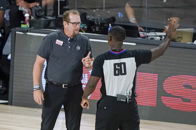 Toronto Raptors' head coach Nick Nurse questions a call during the first half of an NBA basketball conference semifinal playoff game against the Boston Celtics Sunday, Aug. 30, 2020, in Lake Buena Vista, Fla. (AP Photo/Ashley Landis)