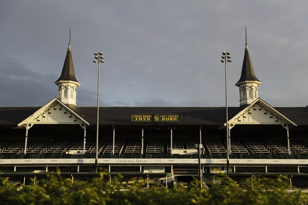 The sun rises over the track at Churchill Downs, Thursday, May 7, 2020, in Louisville, Ky. The Kentucky Derby has been postponed until Sept. 5 because of the coronavirus. (AP Photo/Darron Cummings)