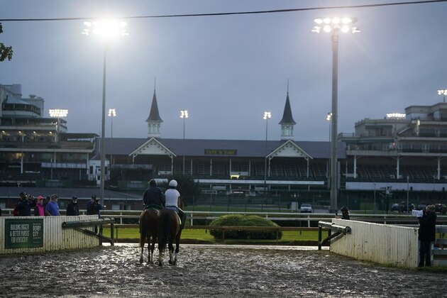 Exercise rider Heather Smullen takes Kentucky Derby entry Tiz the Law out for a workout at Churchill Downs, Wednesday, Sept. 2, 2020, in Louisville, Ky. (AP Photo/Darron Cummings)