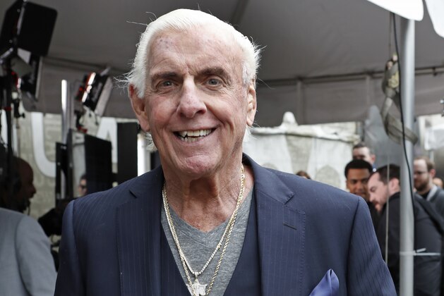 IMAGE DISTRIBUTED FOR XBOX - Ric Flair plays WWE 2K 18 on Xbox One X from Wrestlemania 34 on Sunday, April 8, 2018, in New Orleans. (Tyler Kaufman/AP Images for Xbox)