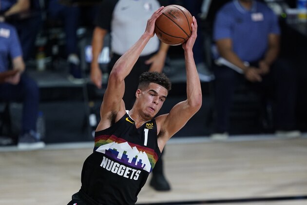 Denver Nuggets' Michael Porter Jr. (1) pulls down a rebound against the Utah Jazz during the first half of an NBA basketball first round playoff game, Monday, Aug. 3, 2020, in Lake Buena Vista, Fla.(AP Photo/Ashley Landis, Pool)