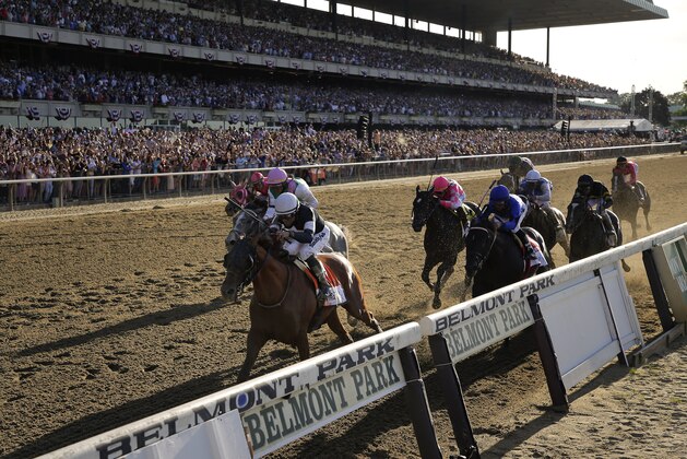 FILE - In this June 8, 2019, file photo, Sir Winston (7), with jockey Joel Rosario up, crosses the finish line to win the 151st running of the Belmont Stakes horse race at Belmont Park in Elmont, N.Y. The Belmont Stakes will be run June 20, 2020, without fans and serve as the opening leg of horse racing's Triple Crown for the first time in the sport's history. The New York Racing Association on Tuesday, May 19, 2020, unveiled the rescheduled date for the Belmont, which will also be contested at a shorter distance than usual. This is the first time the Belmont will lead off the Triple Crown ahead of the Kentucky Derby and Preakness. (AP Photo/Seth Wenig, File)