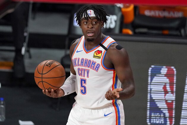 Oklahoma City Thunder's Luguentz Dort holds the ball after an officials call during the first half of an NBA first-round playoff basketball game against the Houston Rockets in Lake Buena Vista, Fla., Wednesday, Sept. 2, 2020. (AP Photo/Mark J. Terrill)