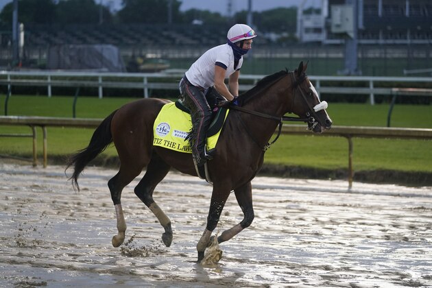 Kentucky Derby entry Tiz the Law runs during a workout at Churchill Downs, Wednesday, Sept. 2, 2020, in Louisville, Ky. The 146th running of the Kentucky Derby is scheduled for Saturday, Sept. 5th. (AP Photo/Darron Cummings)