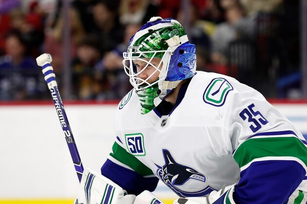Vancouver Canucks goaltender Thatcher Demko (35) defends the goal during the second period of an NHL hockey game against the Carolina Hurricanes in Raleigh, N.C., Sunday, Feb. 2, 2020. (AP Photo/Gerry Broome)