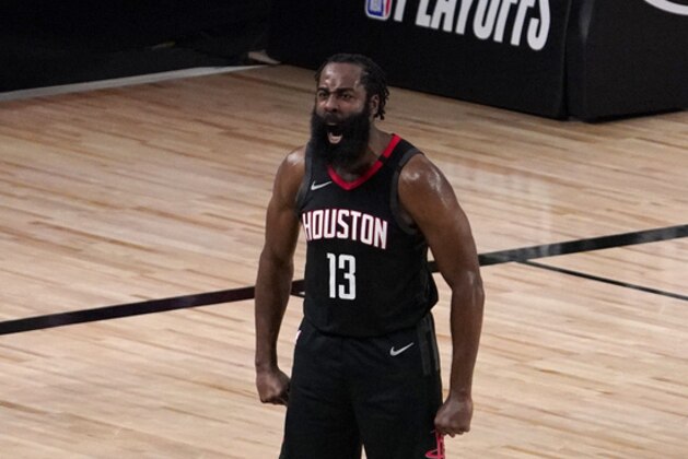 Houston Rockets' James Harden (13) celebrates after blocking a 3-point shot attempt by Oklahoma City Thunder's Luguentz Dort (5) during the second half of an NBA first-round playoff basketball game in Lake Buena Vista, Fla., Wednesday, Sept. 2, 2020. (AP Photo/Mark J. Terrill)