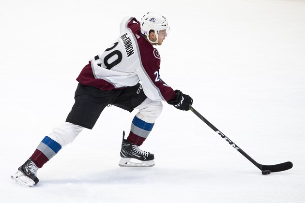 Colorado Avalanche center Nathan MacKinnon (29) skates with the puck during the third period of an NHL hockey game against the Dallas Stars in Dallas, Tuesday, Nov. 5, 2019. (AP Photo/Sam Hodde)