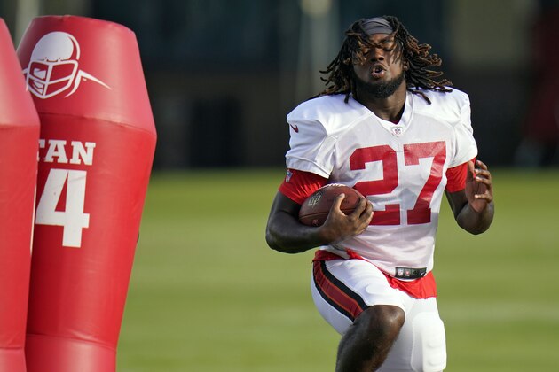 Tampa Bay Buccaneers running back Ronald Jones II (27) runs during an NFL football training camp practice Tuesday, Aug. 18, 2020, in Tampa, Fla. (AP Photo/Chris O'Meara)