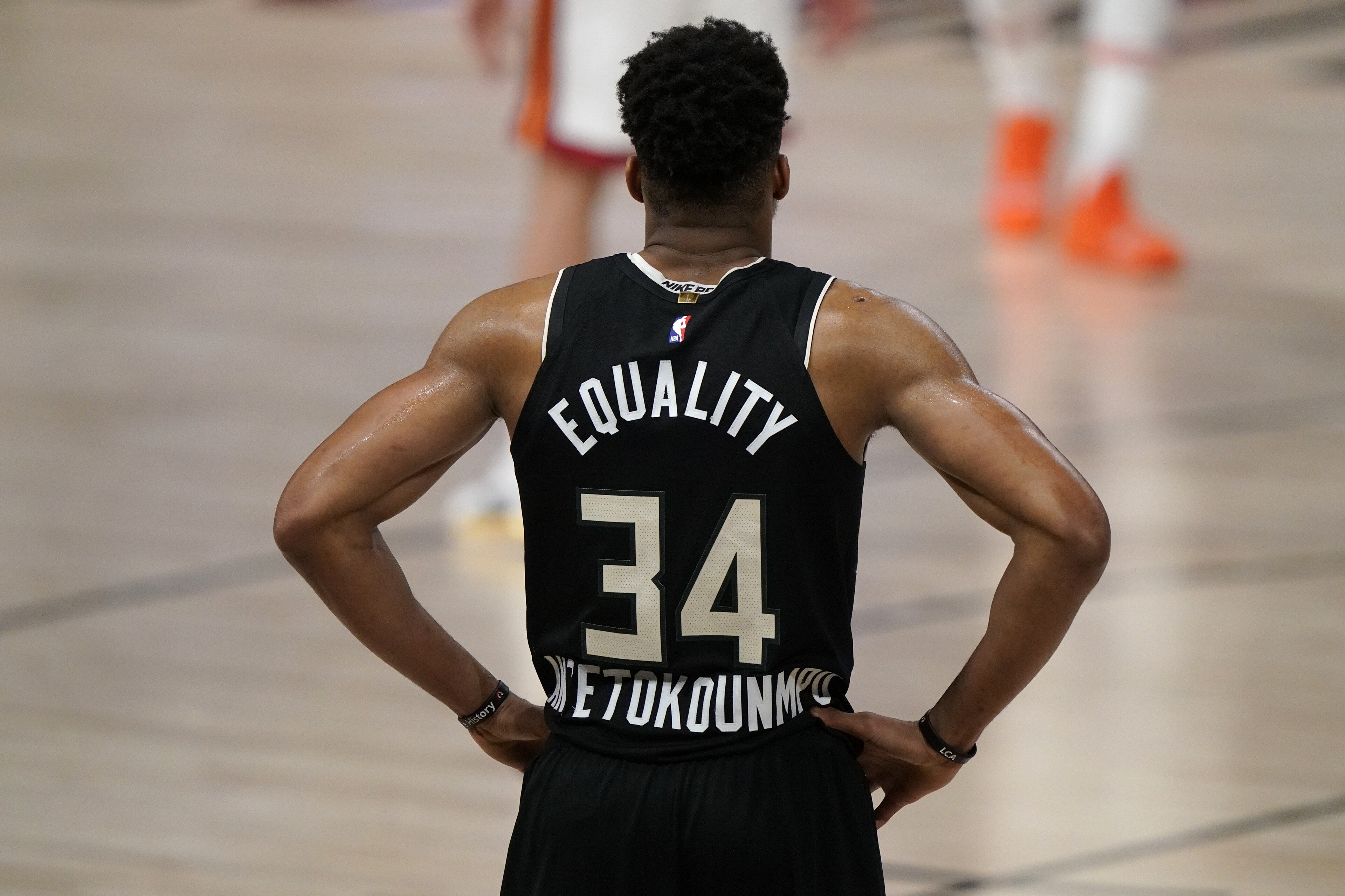 Milwaukee Bucks' Giannis Antetokounmpo (34) stands on the court during the second half of an NBA conference semifinal playoff basketball game against the Miami Heat, Wednesday, Sept. 2, 2020, in Lake Buena Vista, Fla. (AP Photo/Mark J. Terrill)