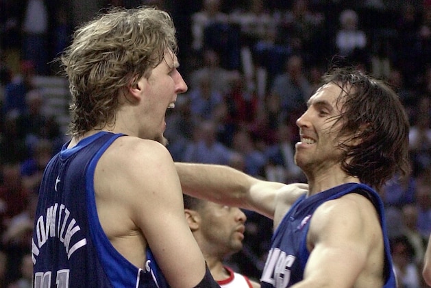 Dallas Mavericks' Dirk Nowitzki, left, celebrates with teammate Steve Nash after Nowitzki scored and was fouled with just over five minutes to play in game three of a first-round NBA playoff series against the Portland Trail Blazers in Portland, Ore., Friday, April 25, 2003. Nowitzki scored 42 points to lead the Mavericks in their 115-103 win. (AP Photo)