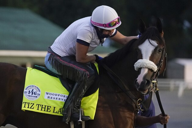 Exercise rider Heather Smullen takes Kentucky Derby entry Tiz the Law out for a workout at Churchill Downs, Wednesday, Sept. 2, 2020, in Louisville, Ky. (AP Photo/Darron Cummings)